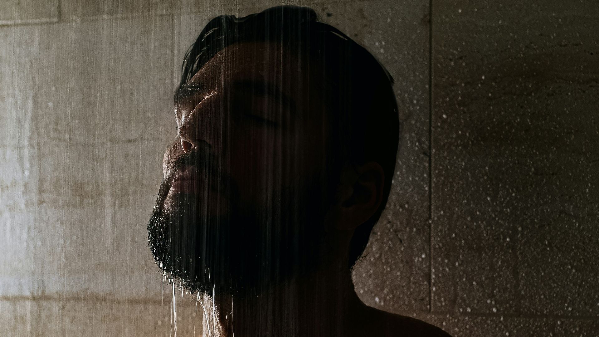 topless woman with black and white plaid scarf
