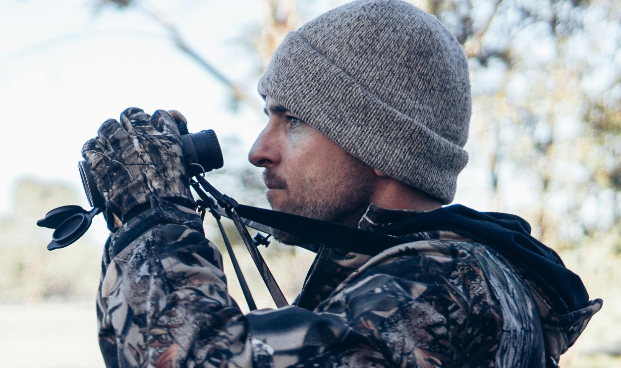Man Holding Binoculars
