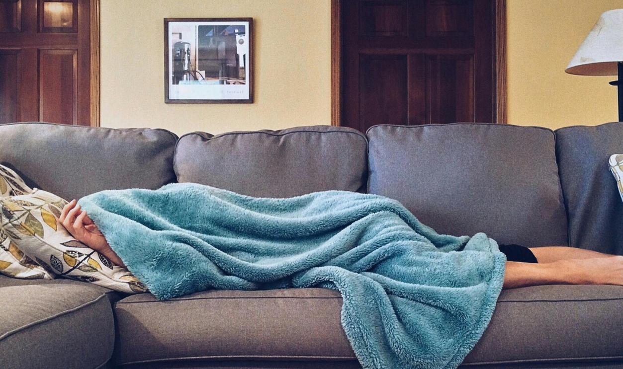Person Lying On Sofa
