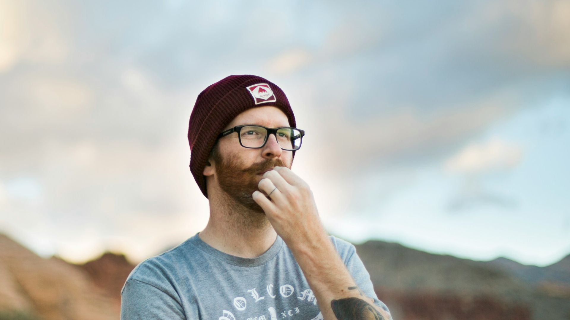 woman in blue crew neck t-shirt wearing black sunglasses