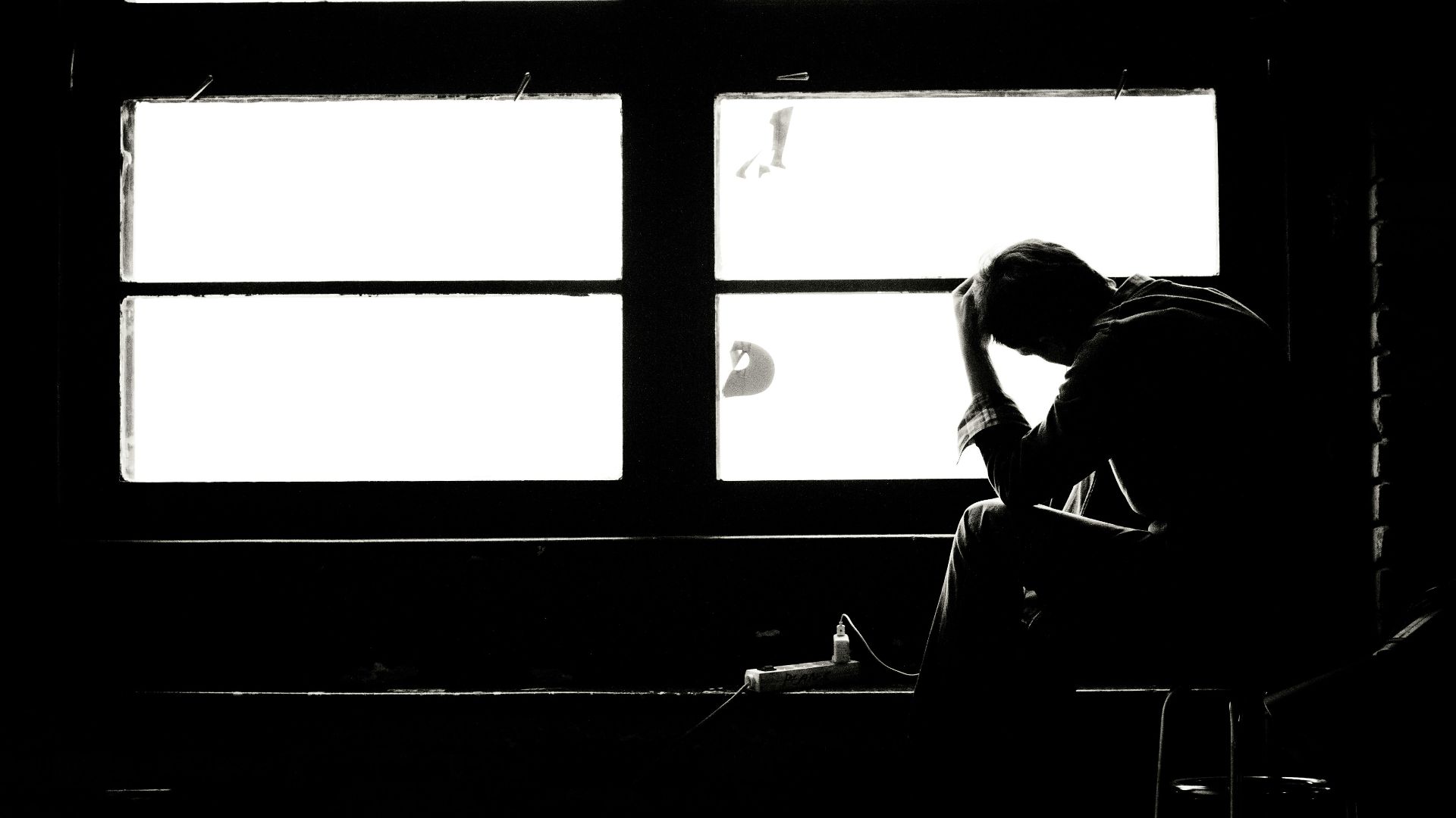 man and woman kissing in grayscale photography