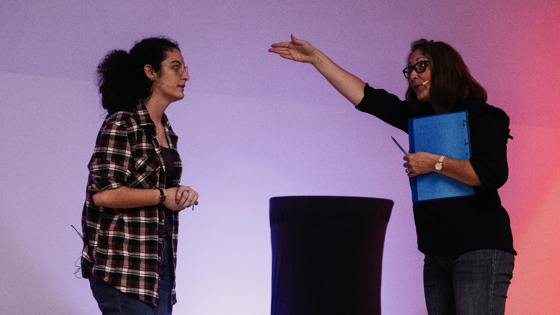 A couple of women standing next to each other