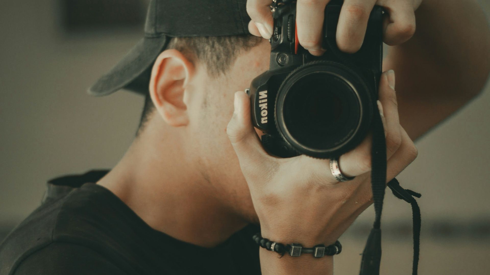 a man holding a camera up to his face