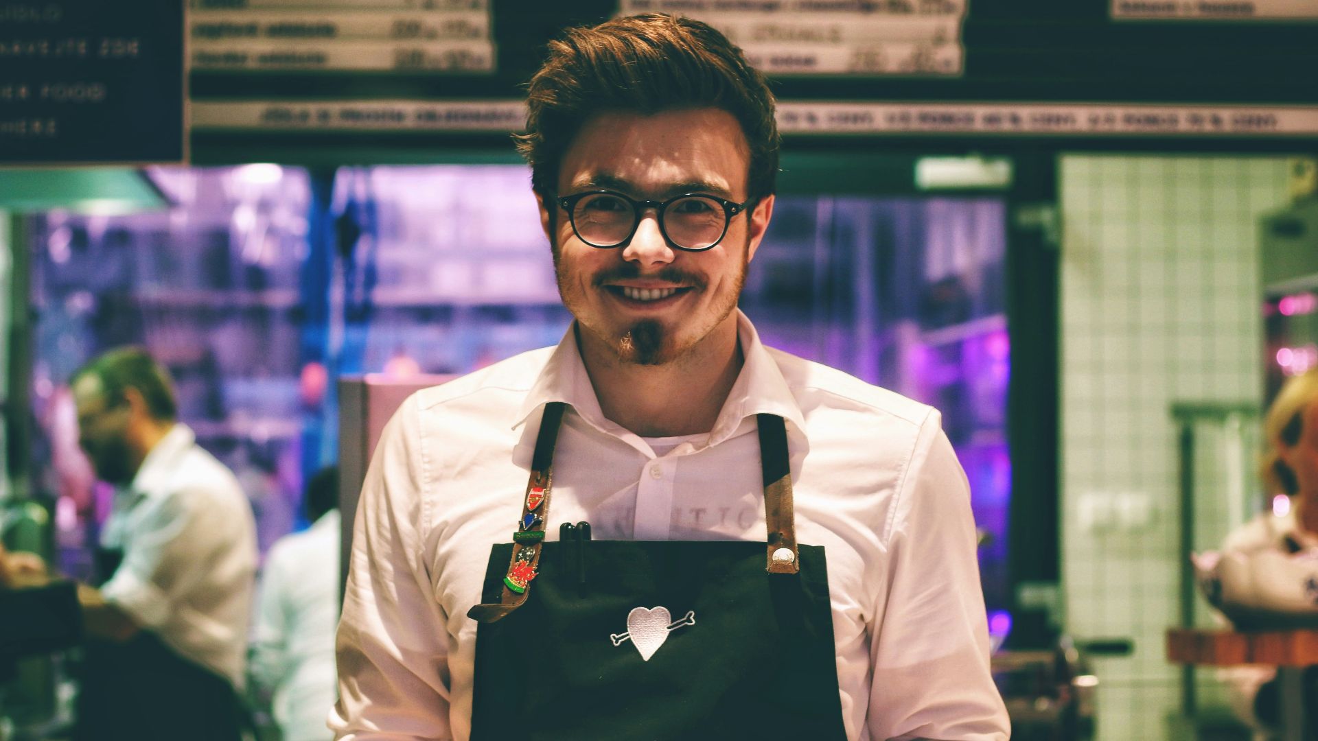 man holding fish dish on plate