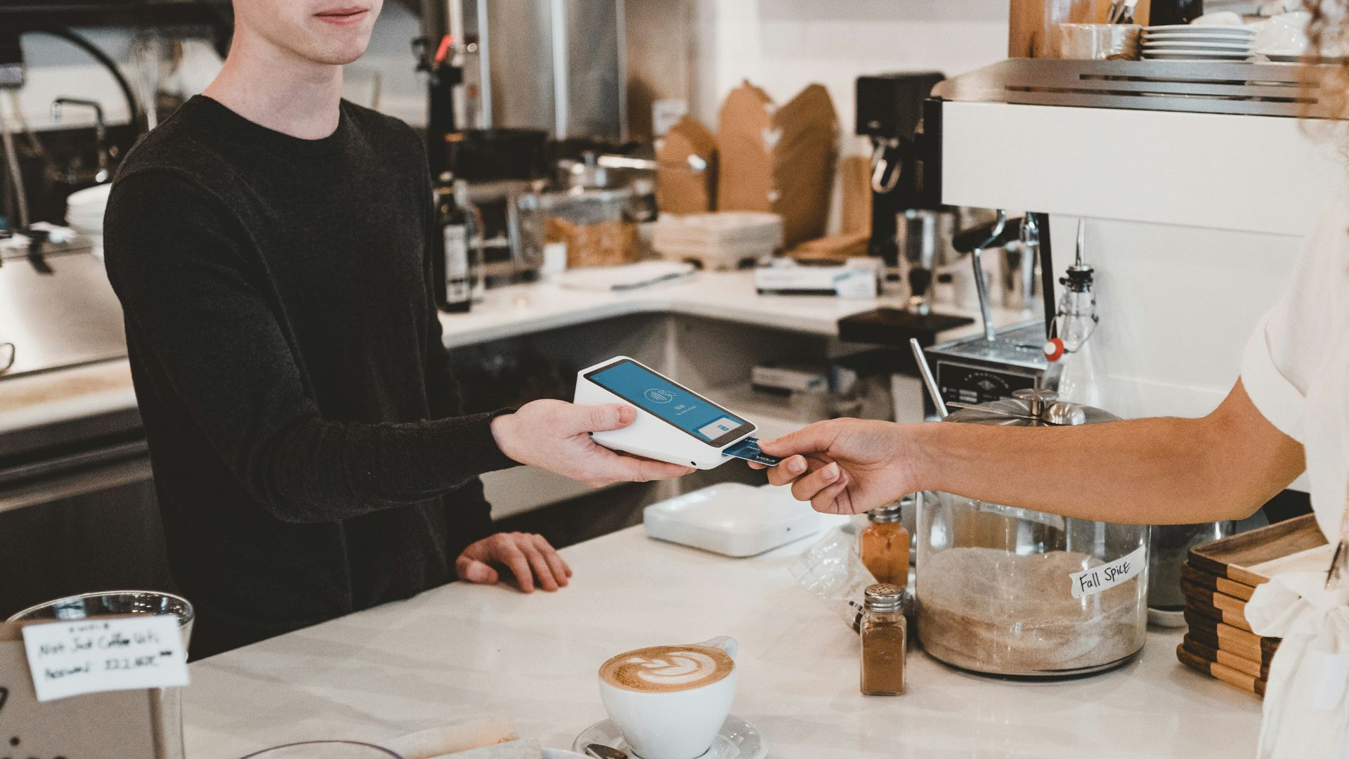 man paying using credit card
