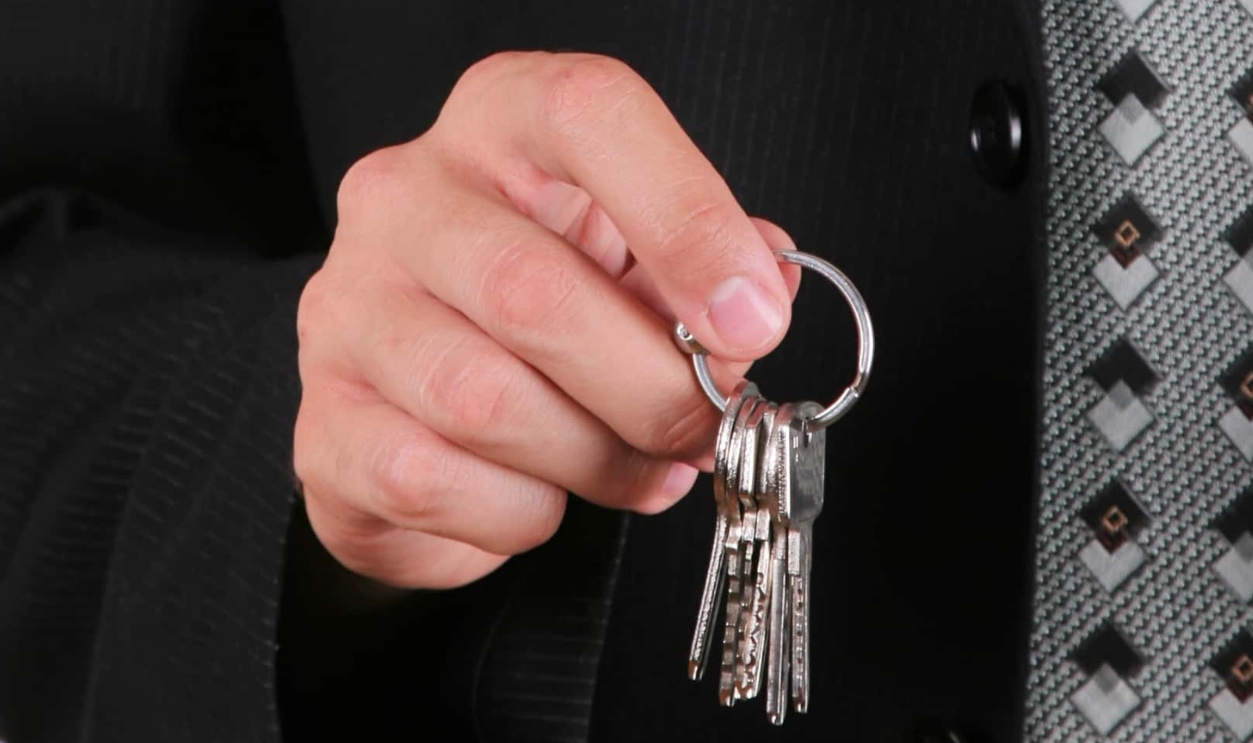 Businessman Holding Key, Shutterstock, 241799398