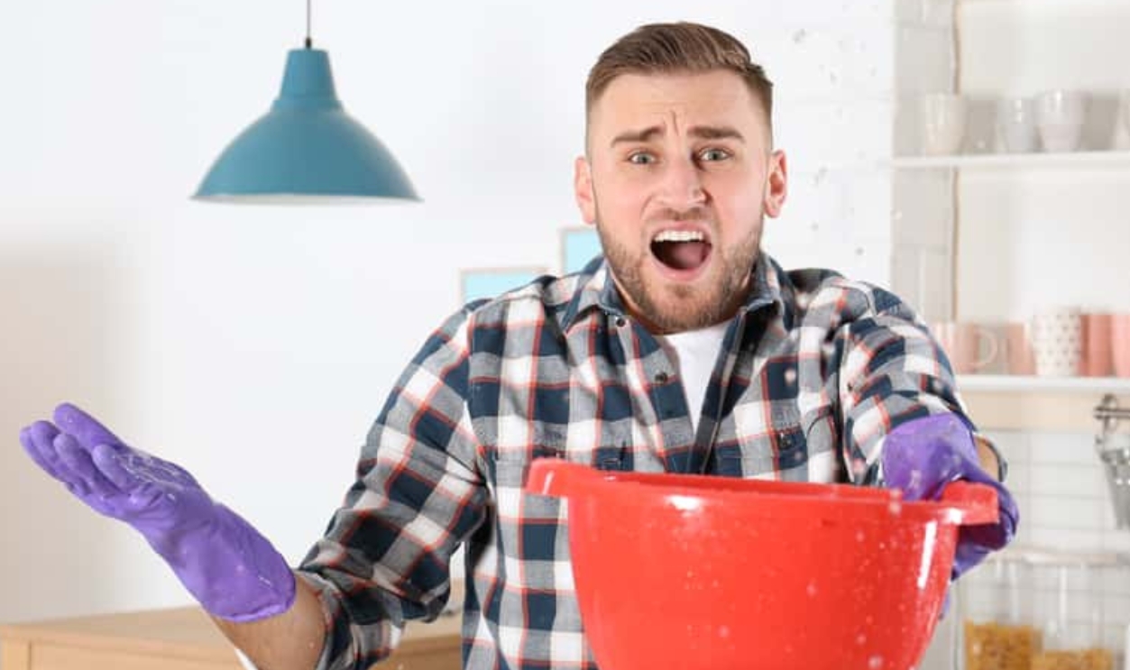 Emotional Young Man Holding Plastic Basin Under Water Leakage, Shutterstock, 1279968001
