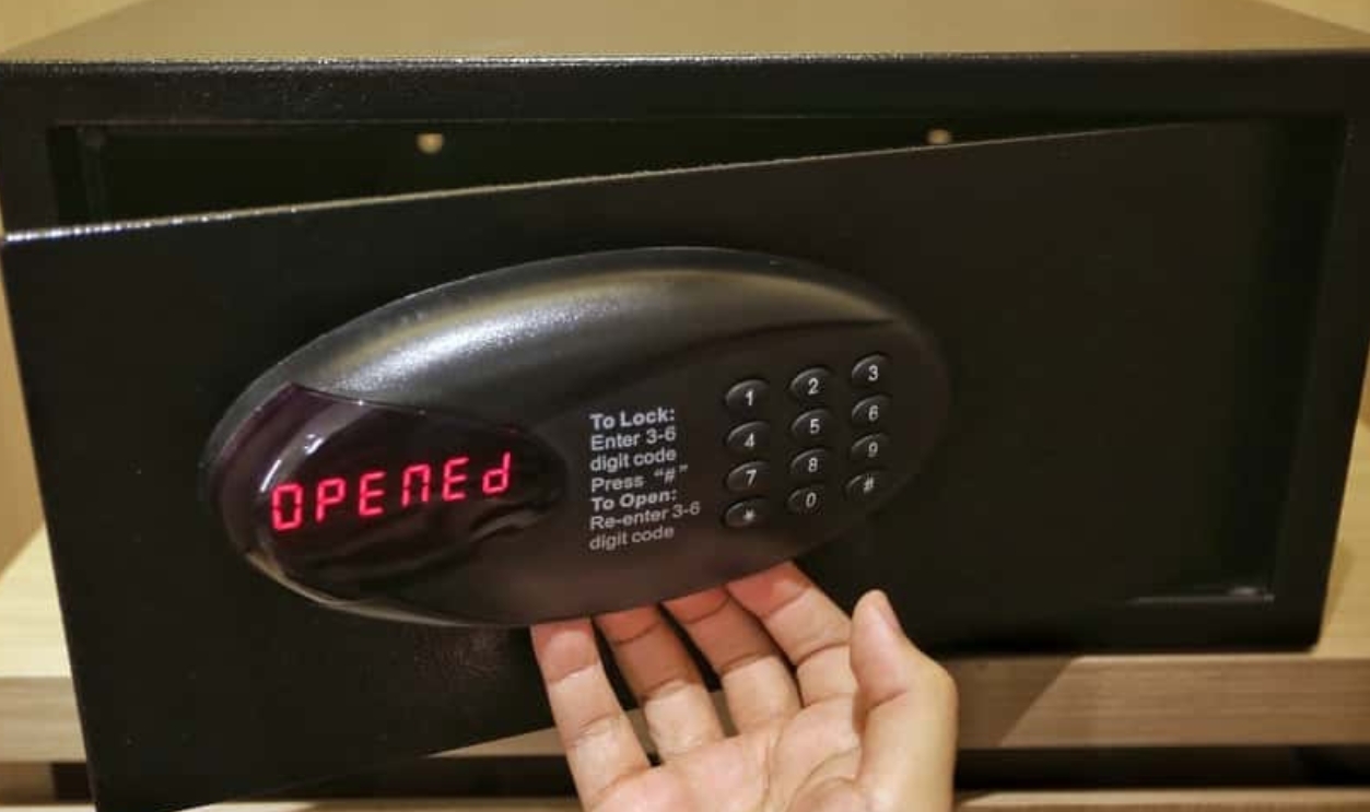 Hand Opening Black Safe, Shutterstock, 722779336