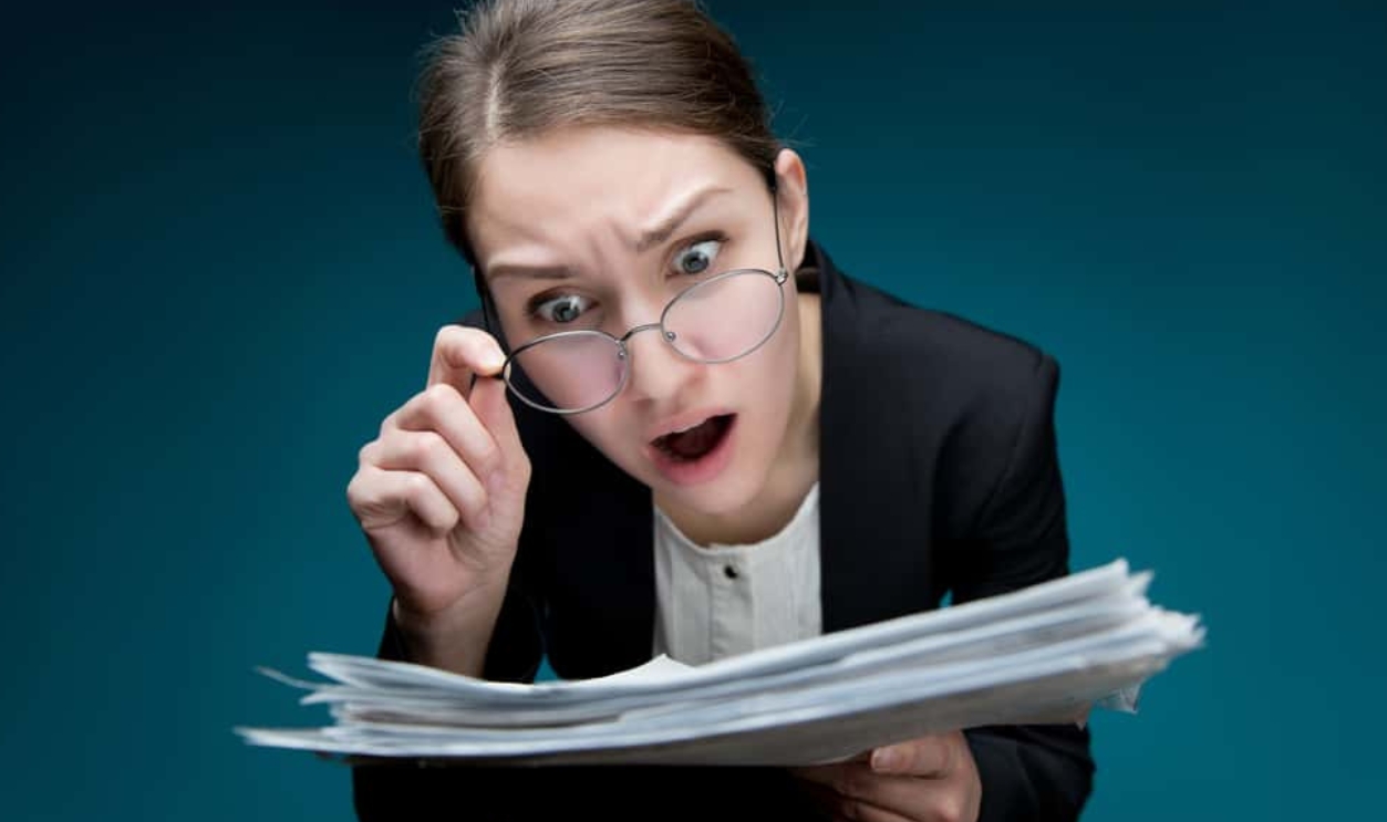 Looks At Documents With Angry Surprise, Shutterstock, 1670007484