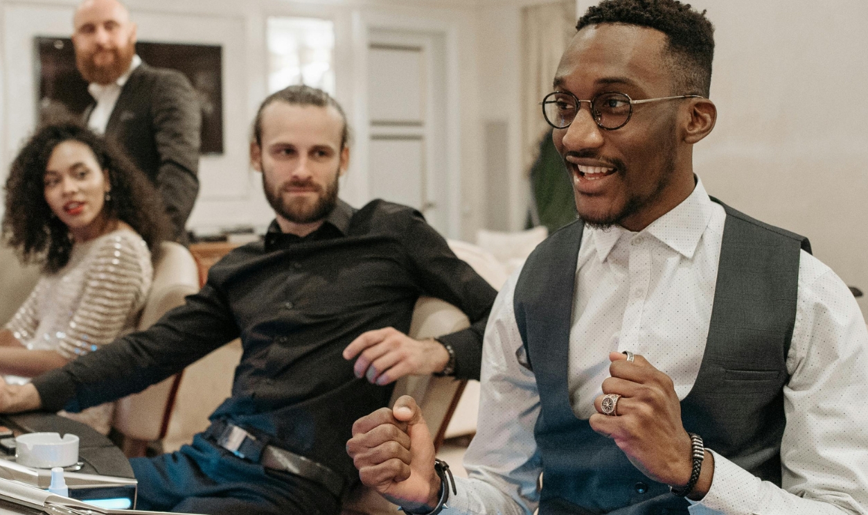 People Looking At The Man Winning At The Slot Machine