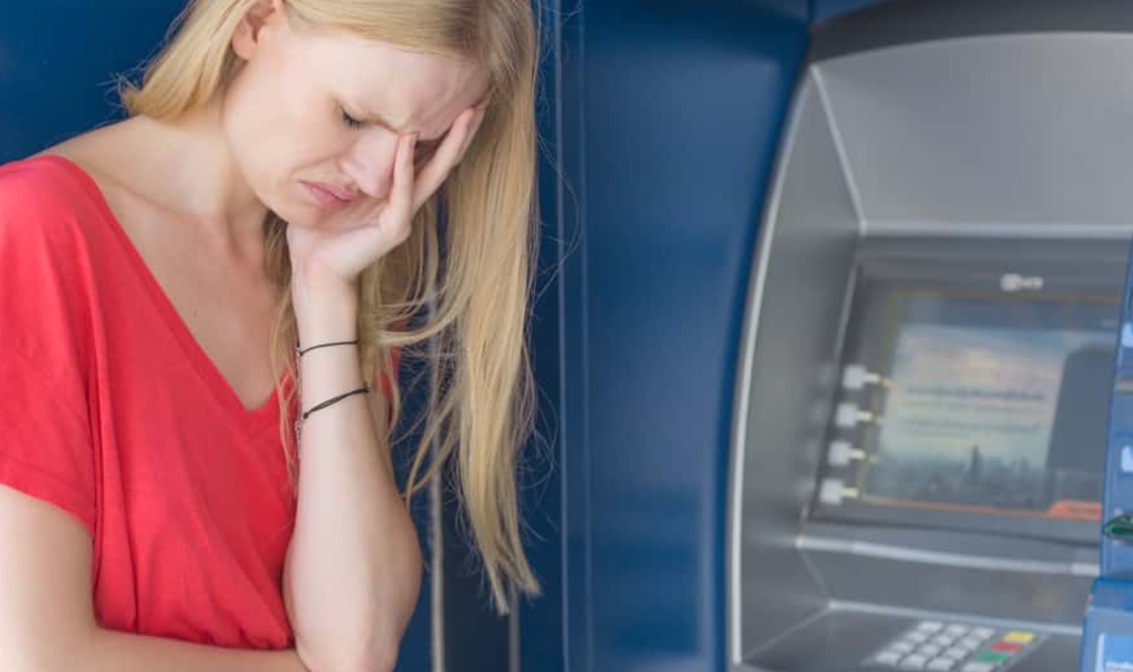 Sad Woman Beside Atm Bank Machine, Shutterstock, 556808257