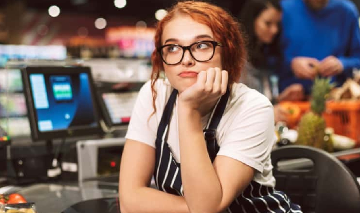 Young Boring Cashier, Shutterstock, 1161693544