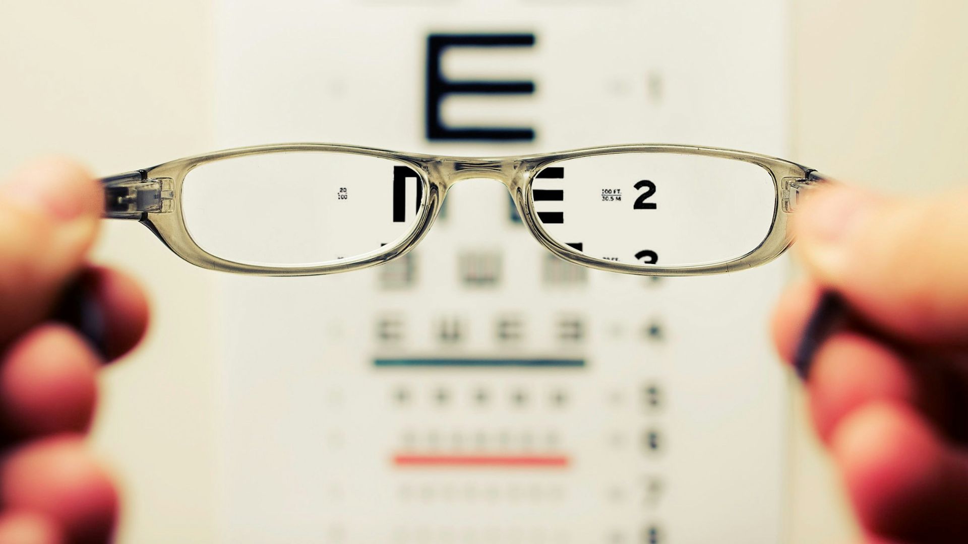 person holding eyeglasses