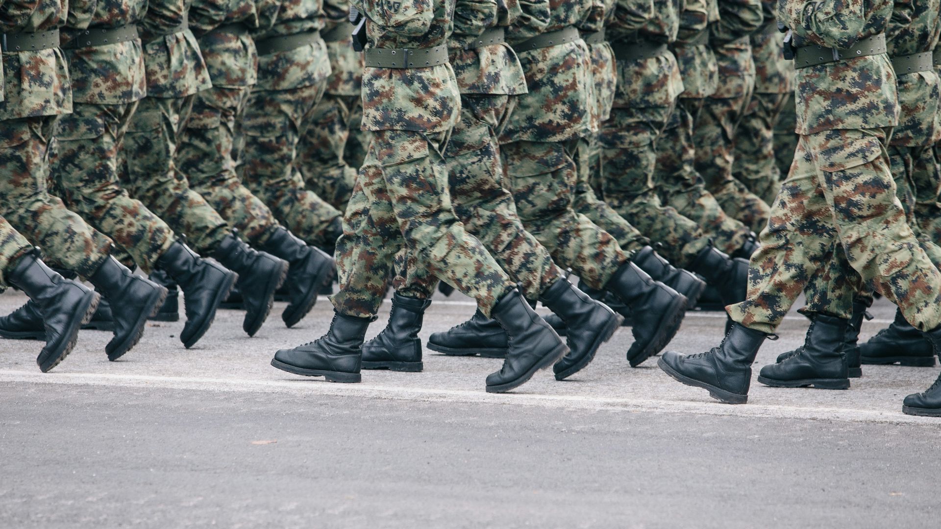men in green and brown camouflage uniform