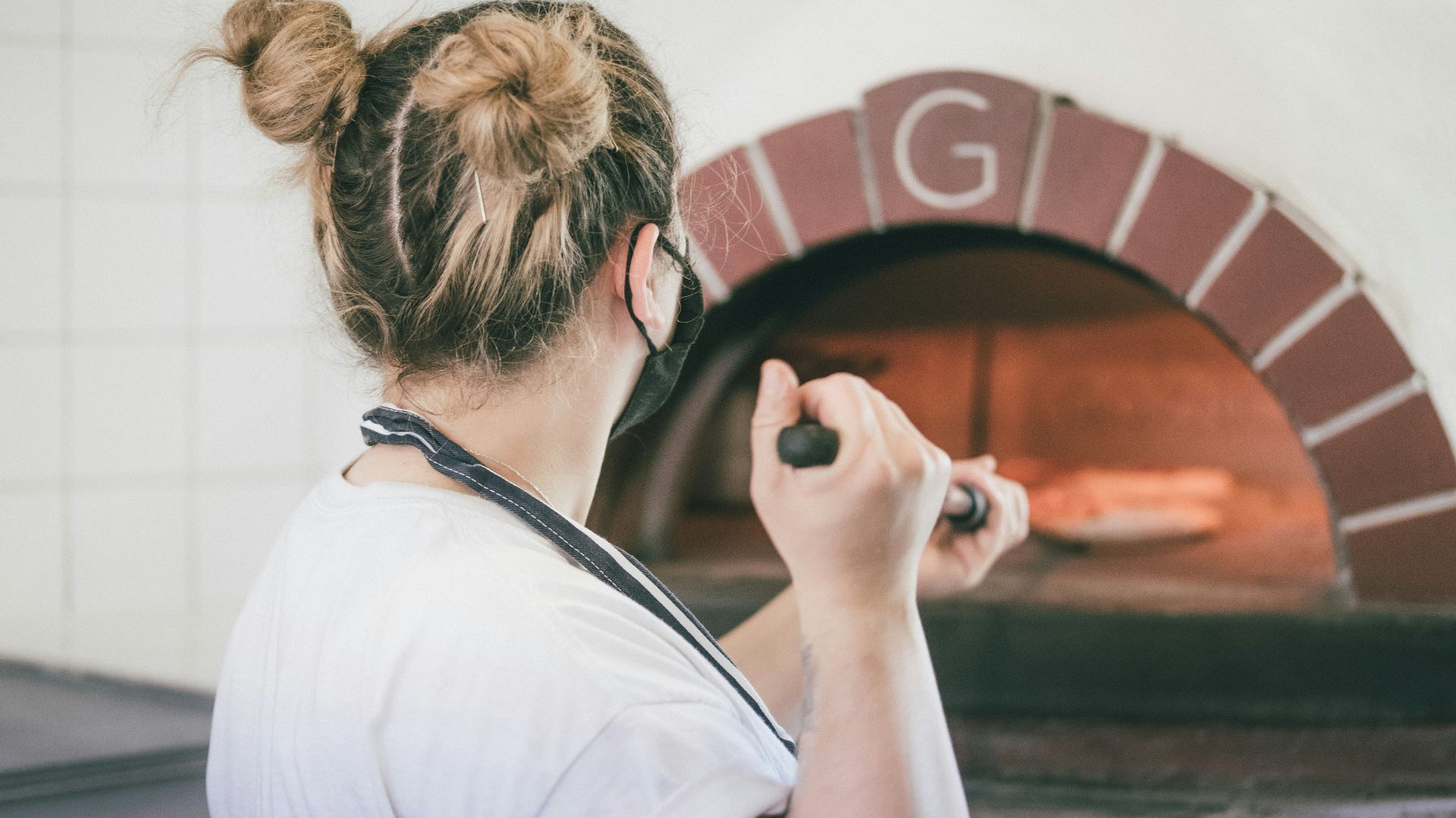 woman in white t-shirt sitting on stairs