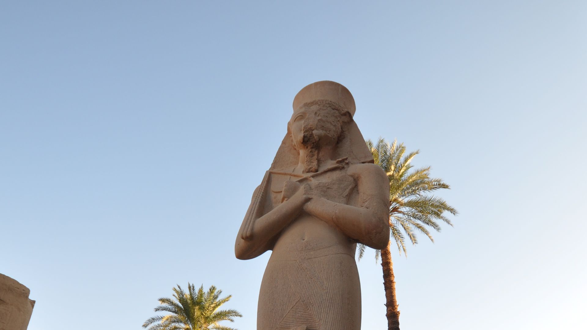 File:Statue of Ramesses II with his daughter,Princess Bint-Anta between his legs flanking the second Pylon (14210622215).jpg