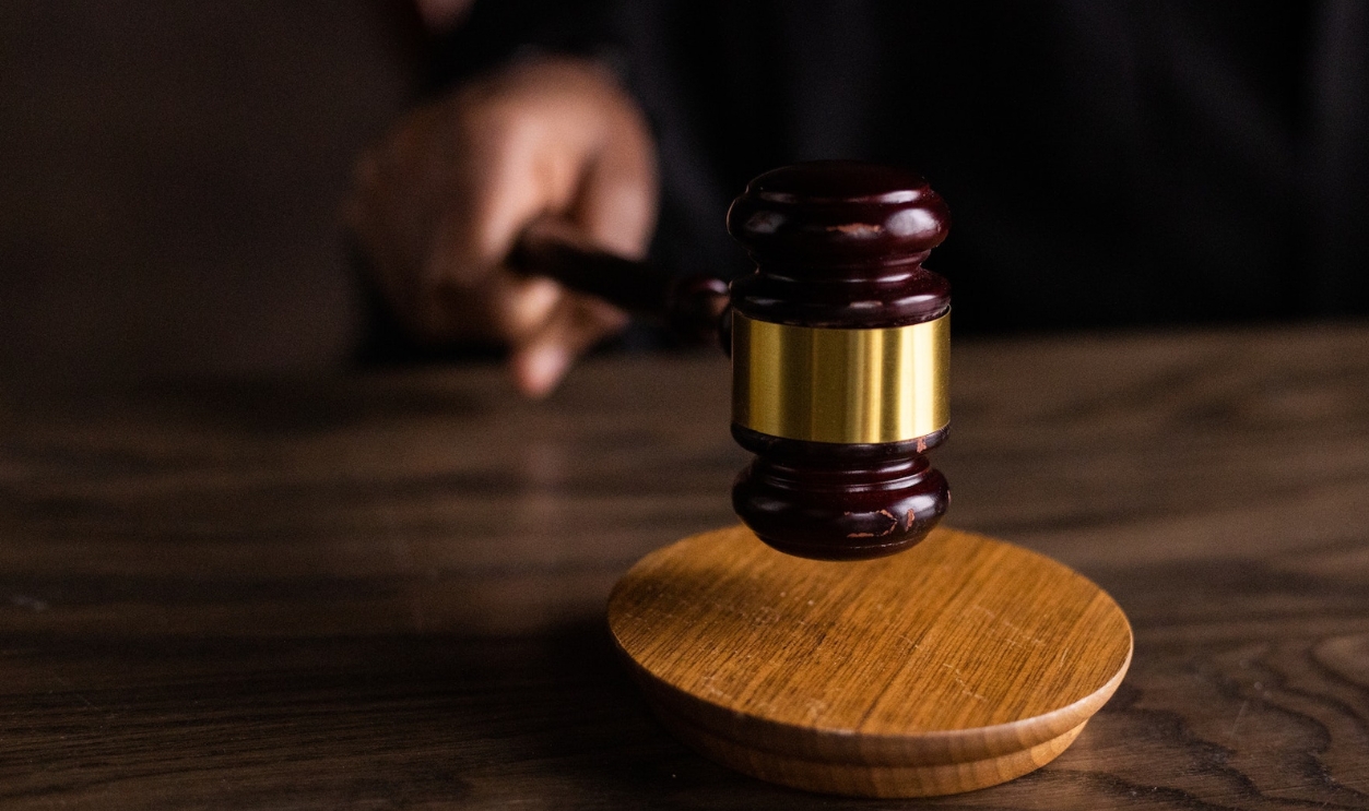 Brown Wooden Gavel On Brown Wooden Table