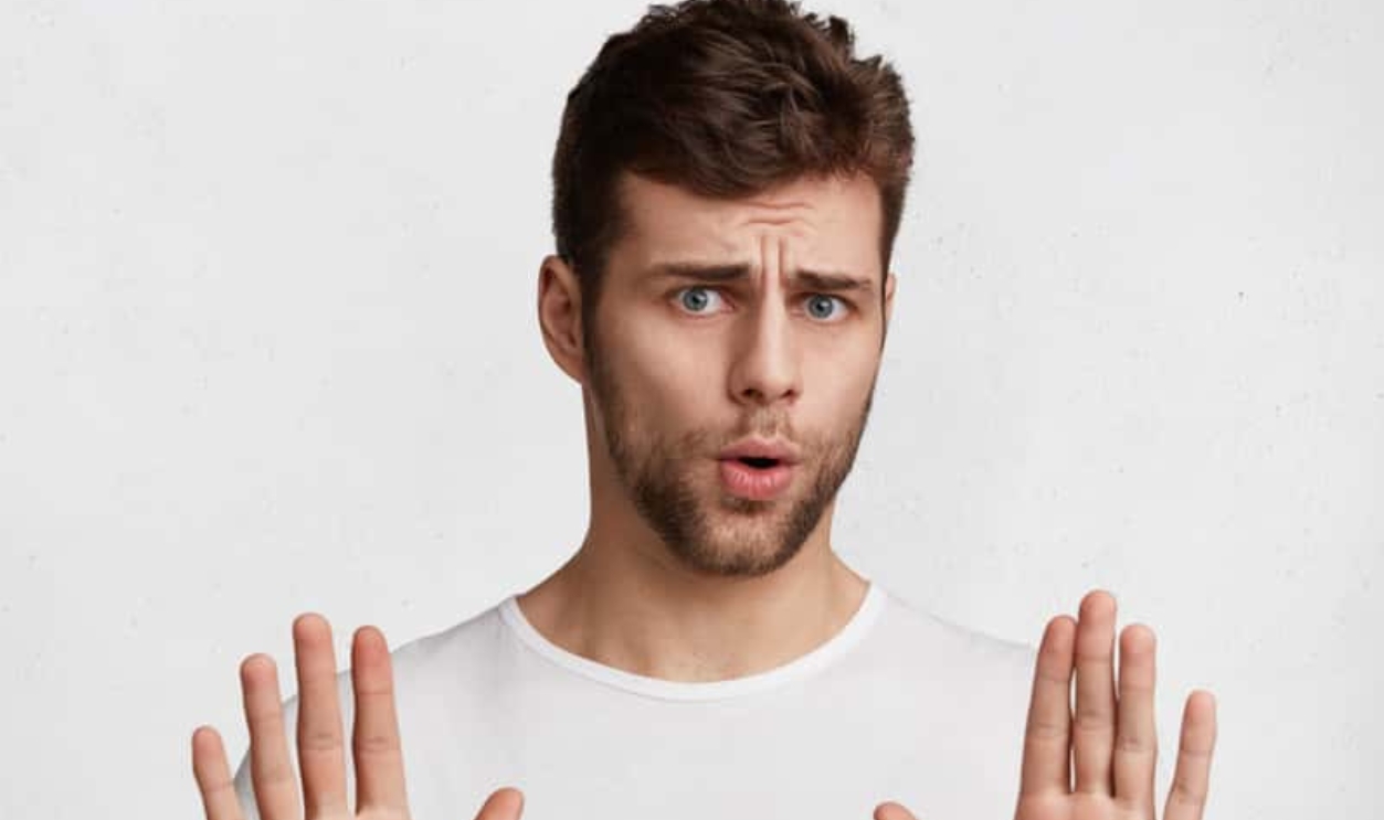 Attractive Brunet Male Shows Refusal Gesture, Shutterstock, 1048817636