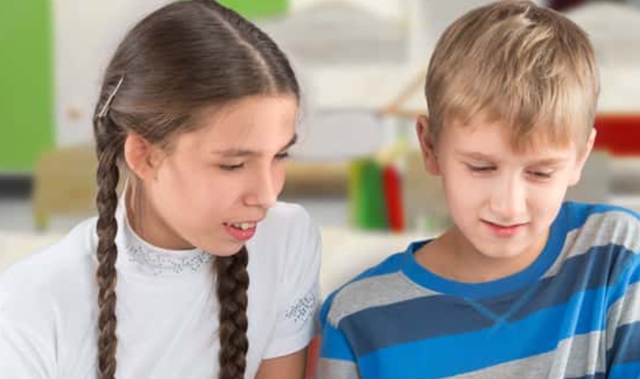 Children Sitting By The Table And Reading A Book, Shutterstock, 157766750