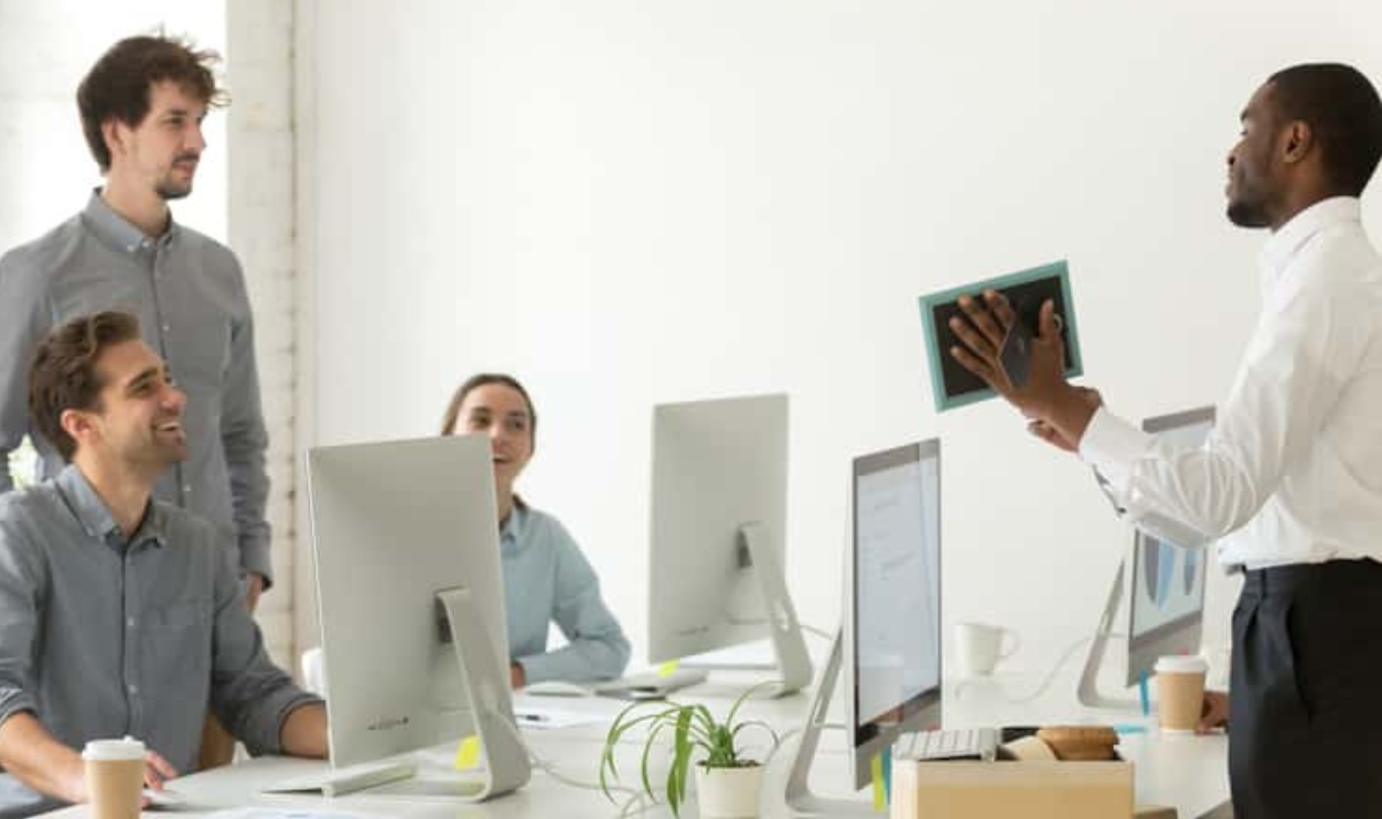 New African Employee Unpacking Boxes, Shutterstock, 1050584258