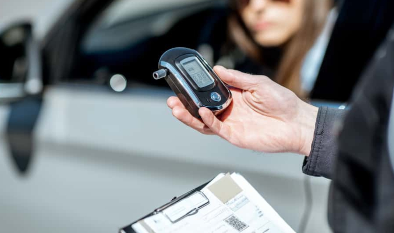Policeman Holding Device For Checking Alcohol, Shutterstock, 1378529927