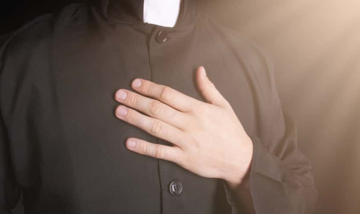 Praying Priest, Shutterstock, 475095466