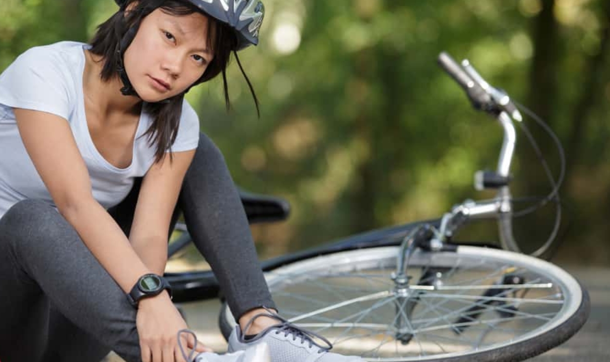 Serious Woman Fell From The Bike, Shutterstock, 1668636997