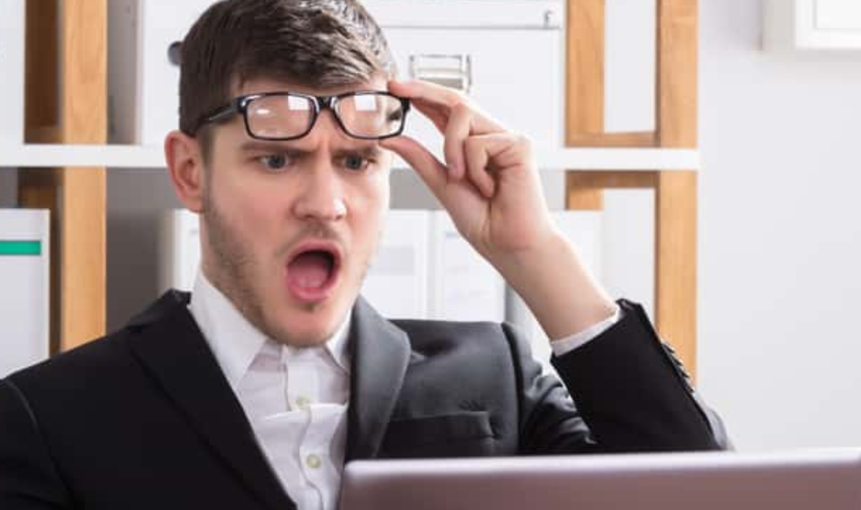 Shocked Young Businessman, Shutterstock, 792860800