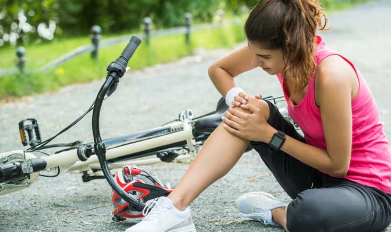 Young Woman Pain Knee When Fallen
