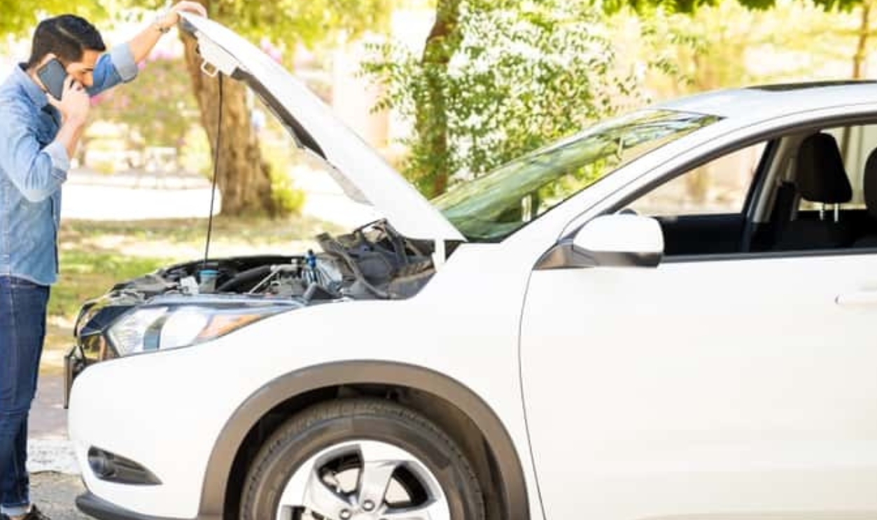 Young Man Standing In Front Of His Broken Car, Shutterstock, 1142047742