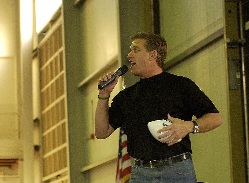 Hall of Fame Quarterback John Elway talks to the troops as he gets ready to fire a few footballs to the crowd