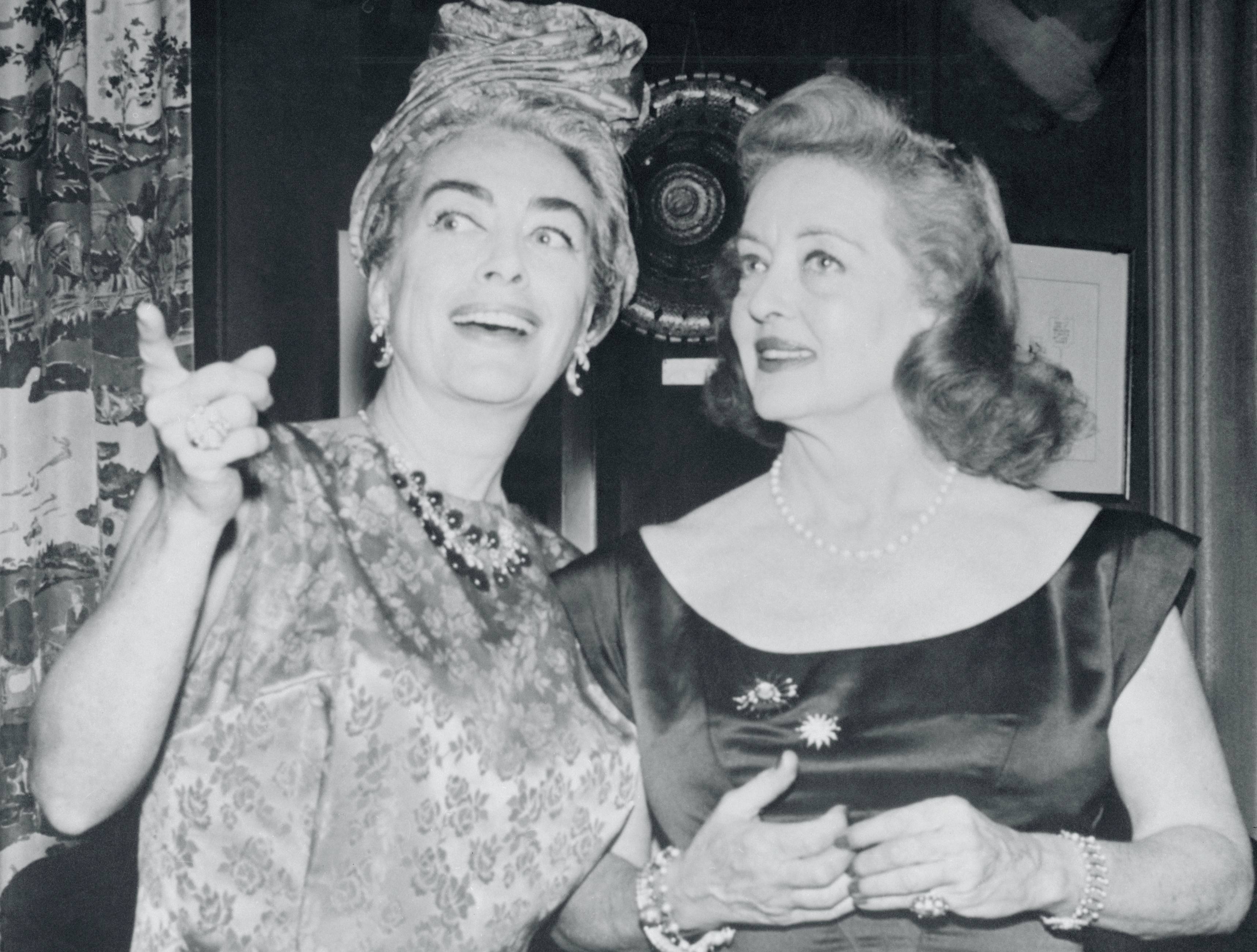 Actresses Bette Davis and Joan Crawford Standing and Talking
