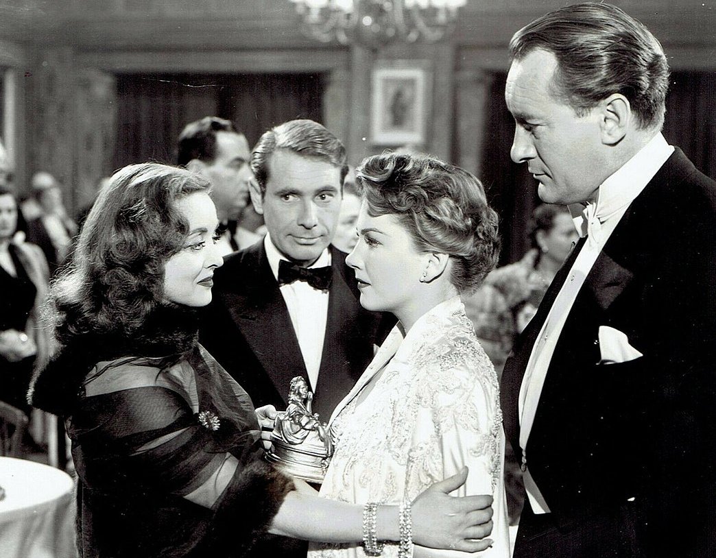 Bette Davis, Gary Merrill, Anne Baxter and George Sanders pose for a studio publicity portrait