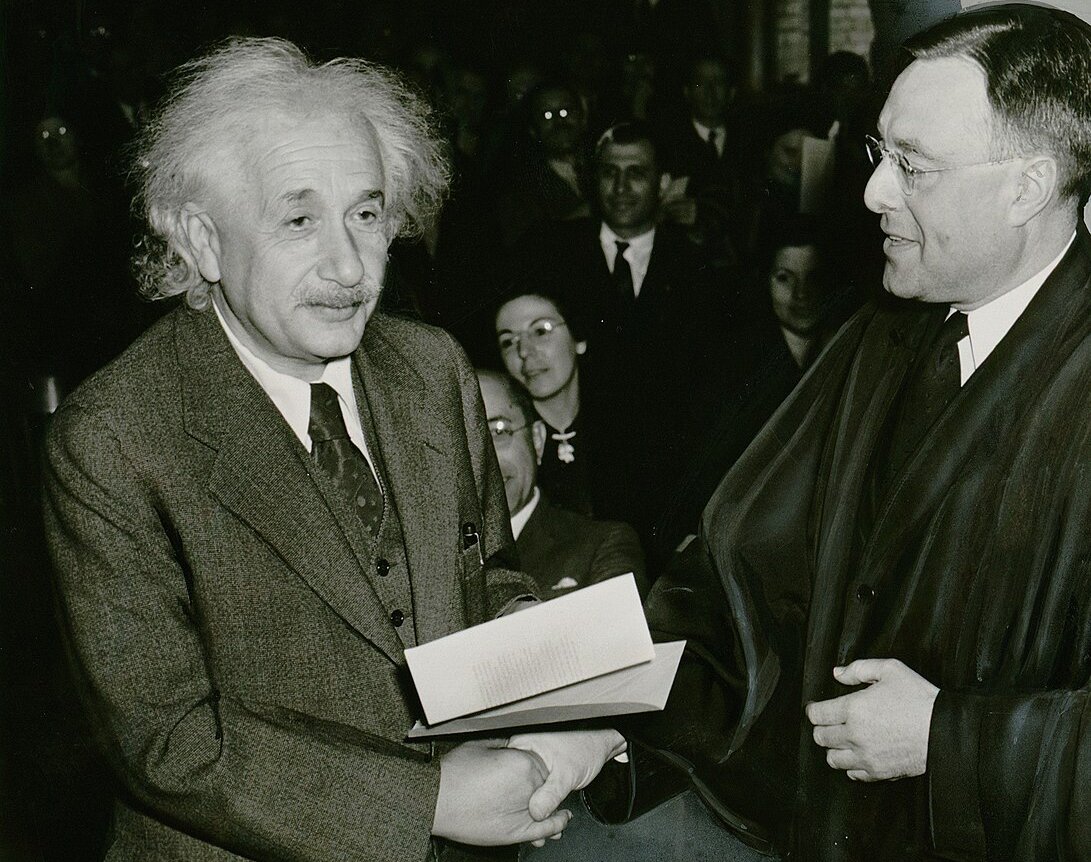 Albert Einstein making a handshake
