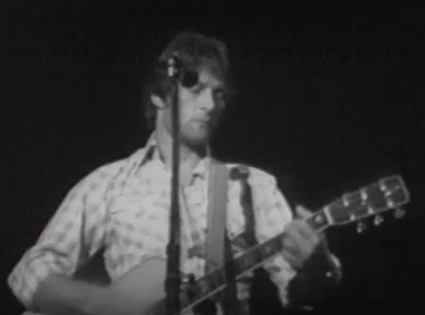 A visually captivating still taken from a pivotal moment in the Concert Gene Clark & Roger McGuinn
