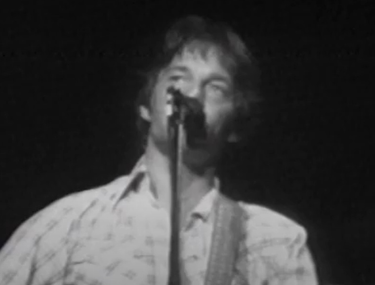 A visually captivating still taken from a pivotal moment in the Concert Gene Clark & Roger McGuinn