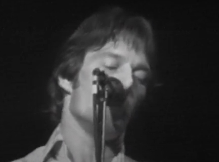 A visually captivating still taken from a pivotal moment in the Concert Gene Clark & Roger McGuinn