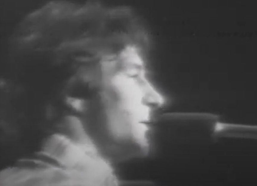 A visually captivating still taken from a pivotal moment in the Concert Gene Clark & Roger McGuinn