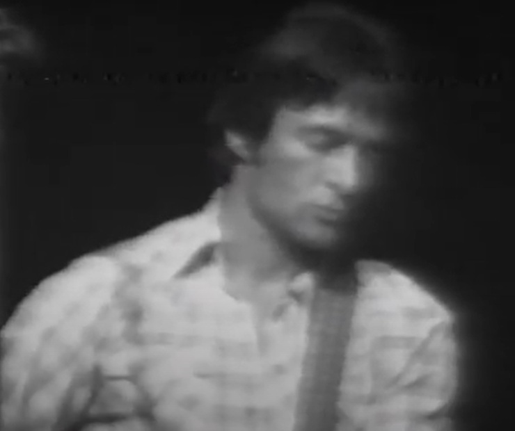 A visually captivating still taken from a pivotal moment in the Concert Gene Clark & Roger McGuinn