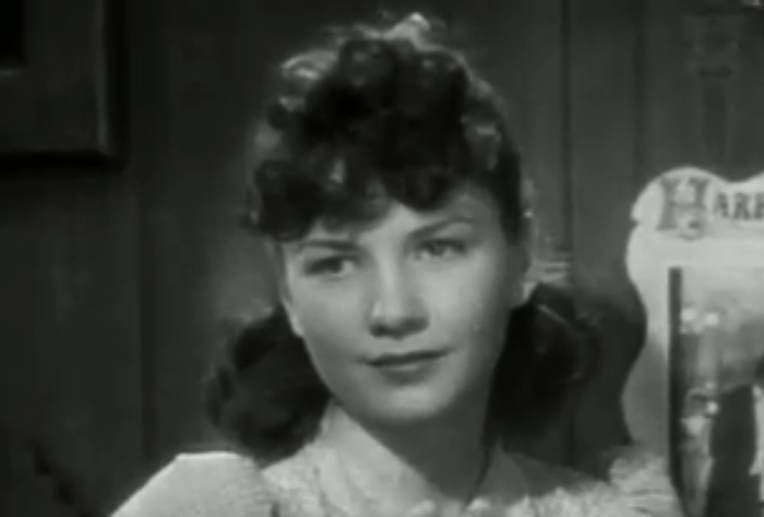 Anne Baxter wearing white shirt in 20 Mule Team