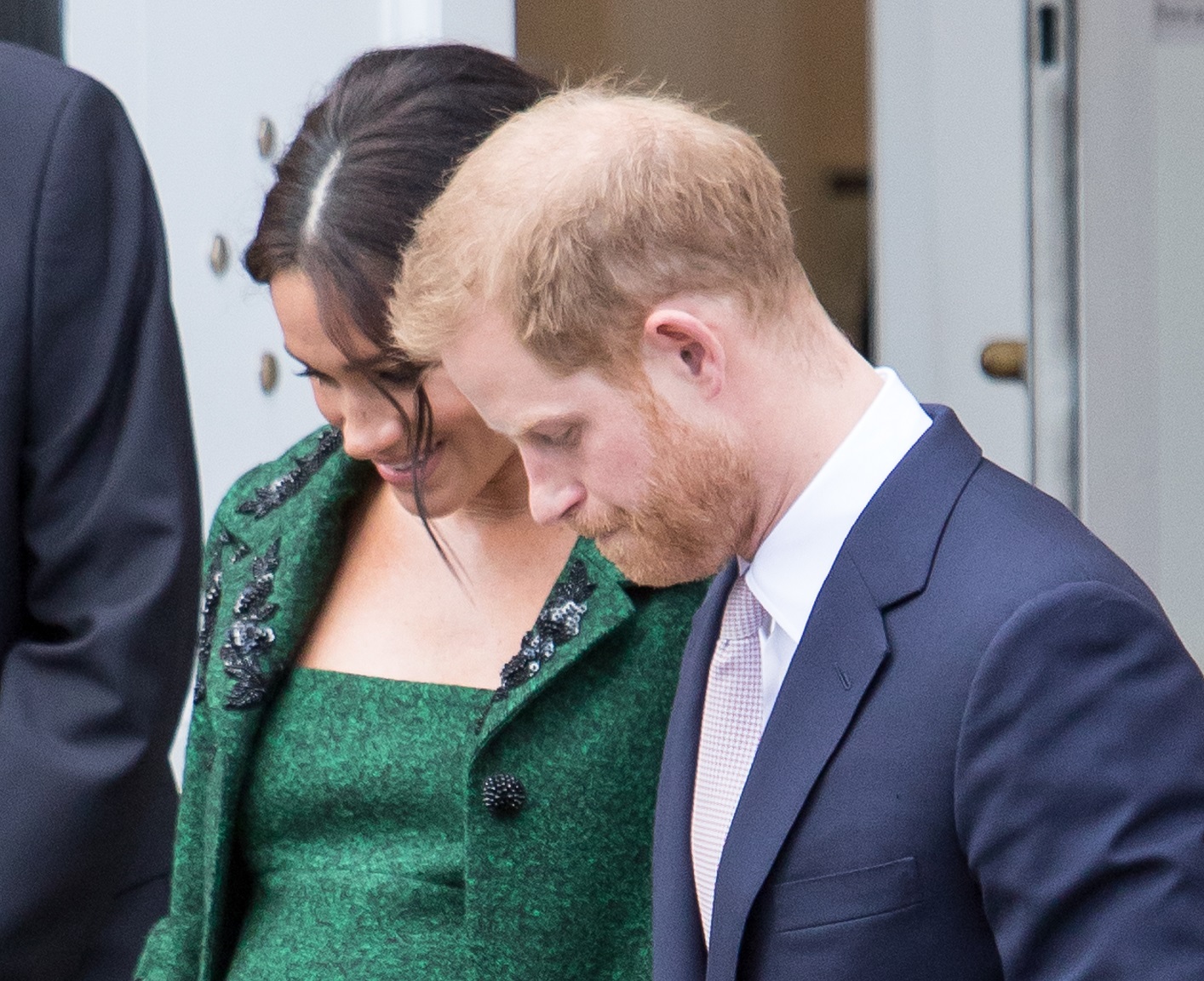 Meghan Markle and Prince Harry receive flowers after leaving Canada House