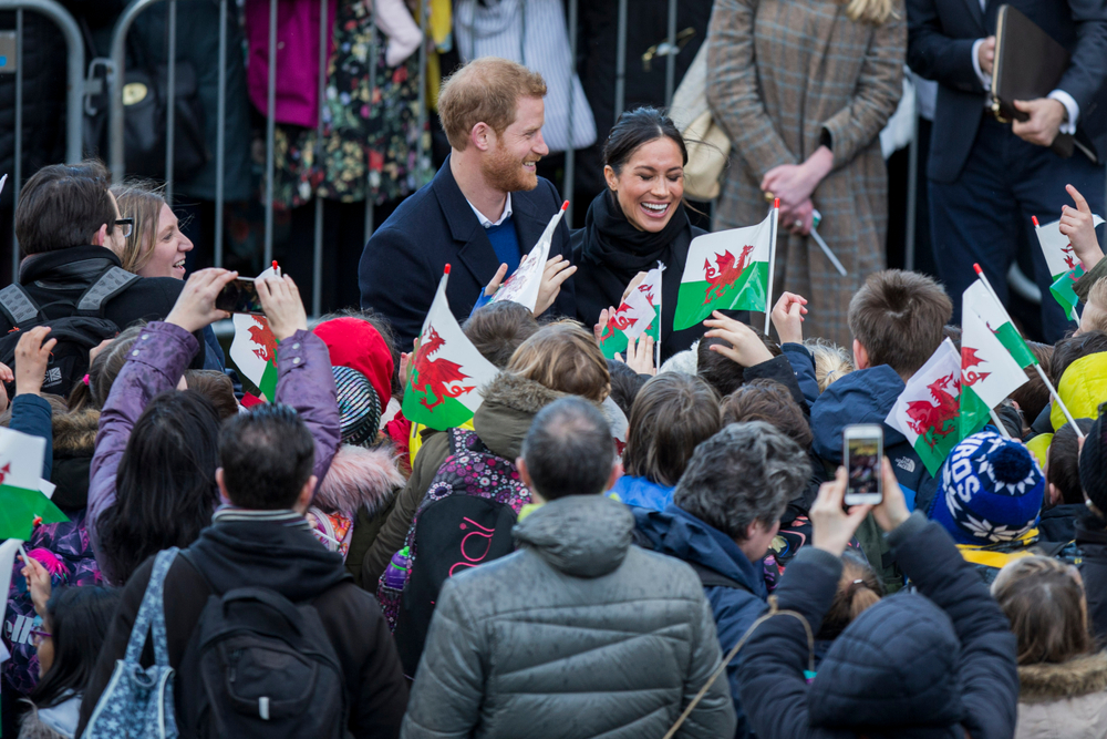 Prince Harry and his fiance Meghan Markle greet schoolchildren