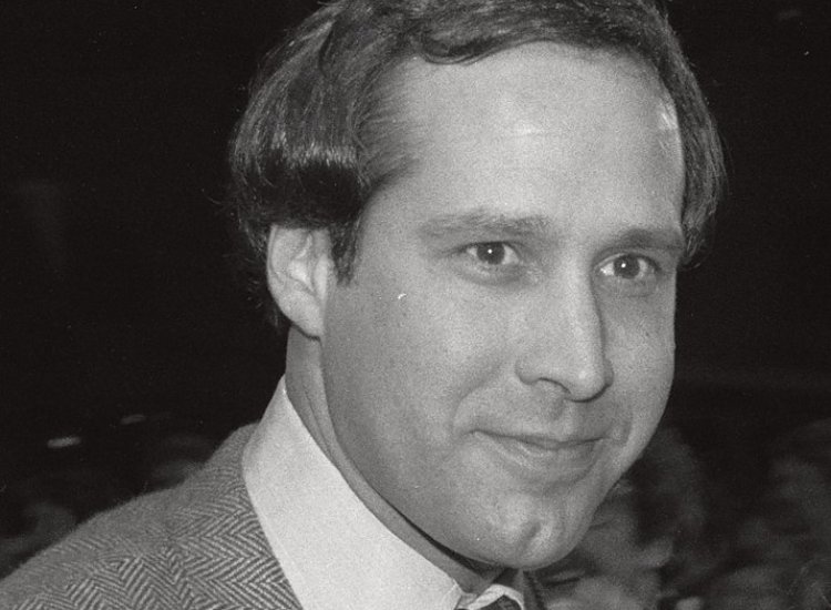 Chevy Chase wearing a suit