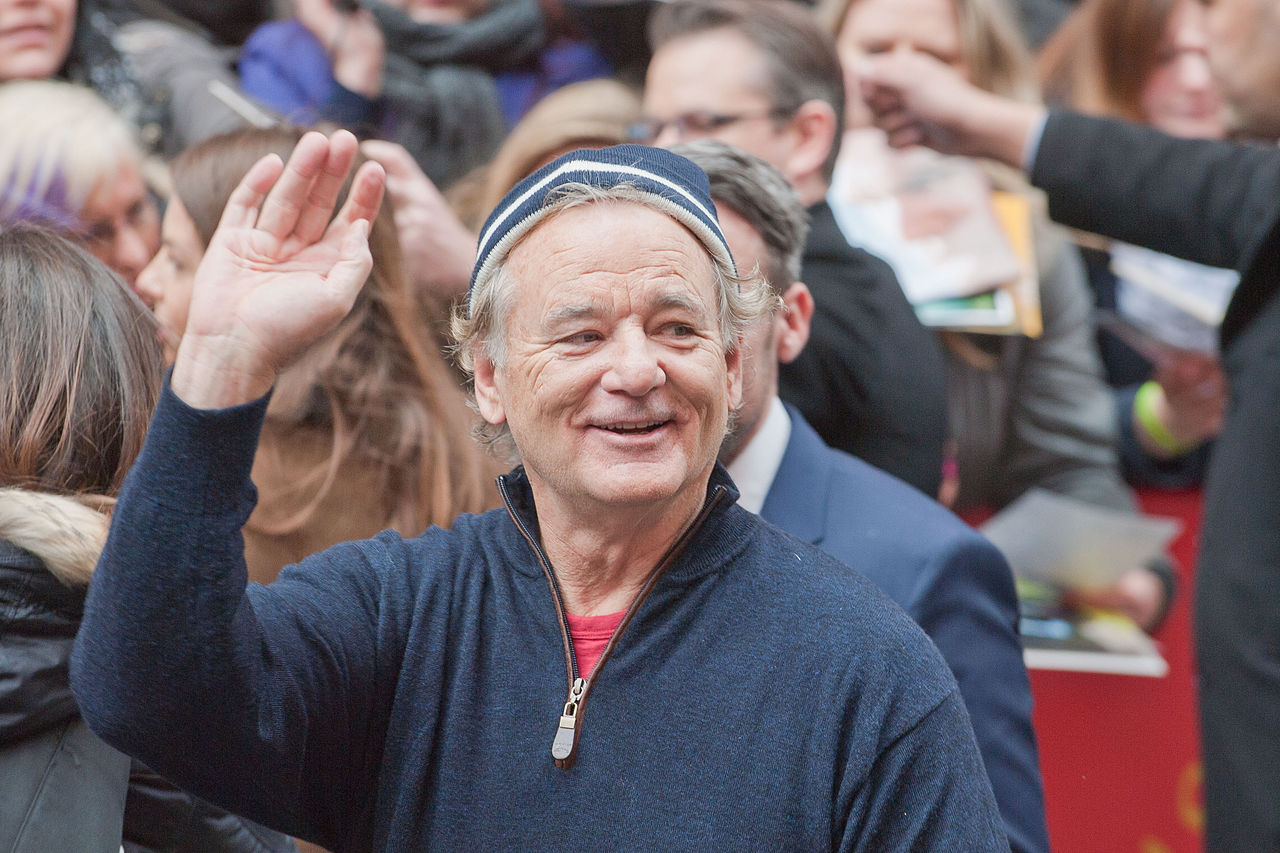 Bill Murray  wearing blue shirt and a hat