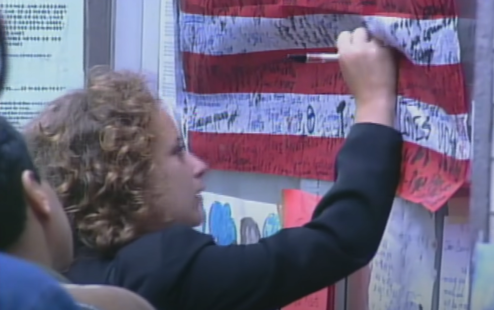 Woman writing on the US flag