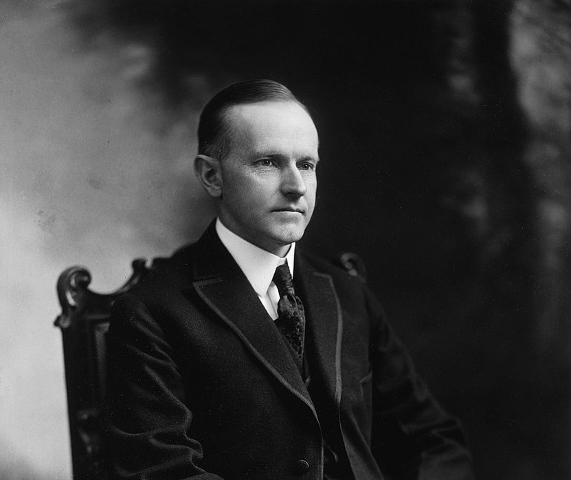 Grayscale Portrait Photo of John Calvin Coolidge Jr. seated