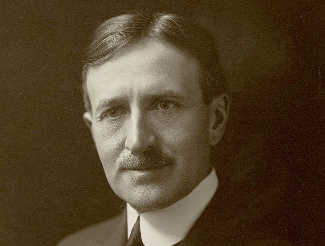 Grayscale Portrait Photo of Harvey Samuel Firestone Sr. facing the camera