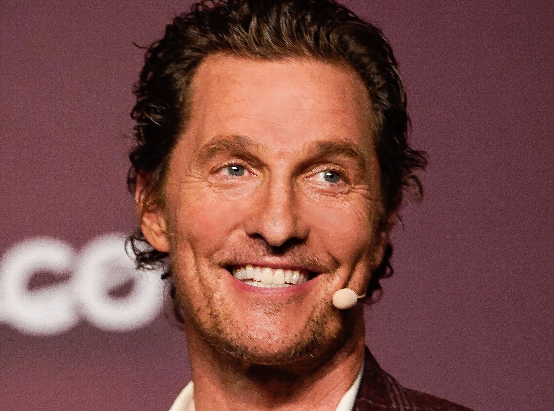 Matthew McConaughey with a white microphone