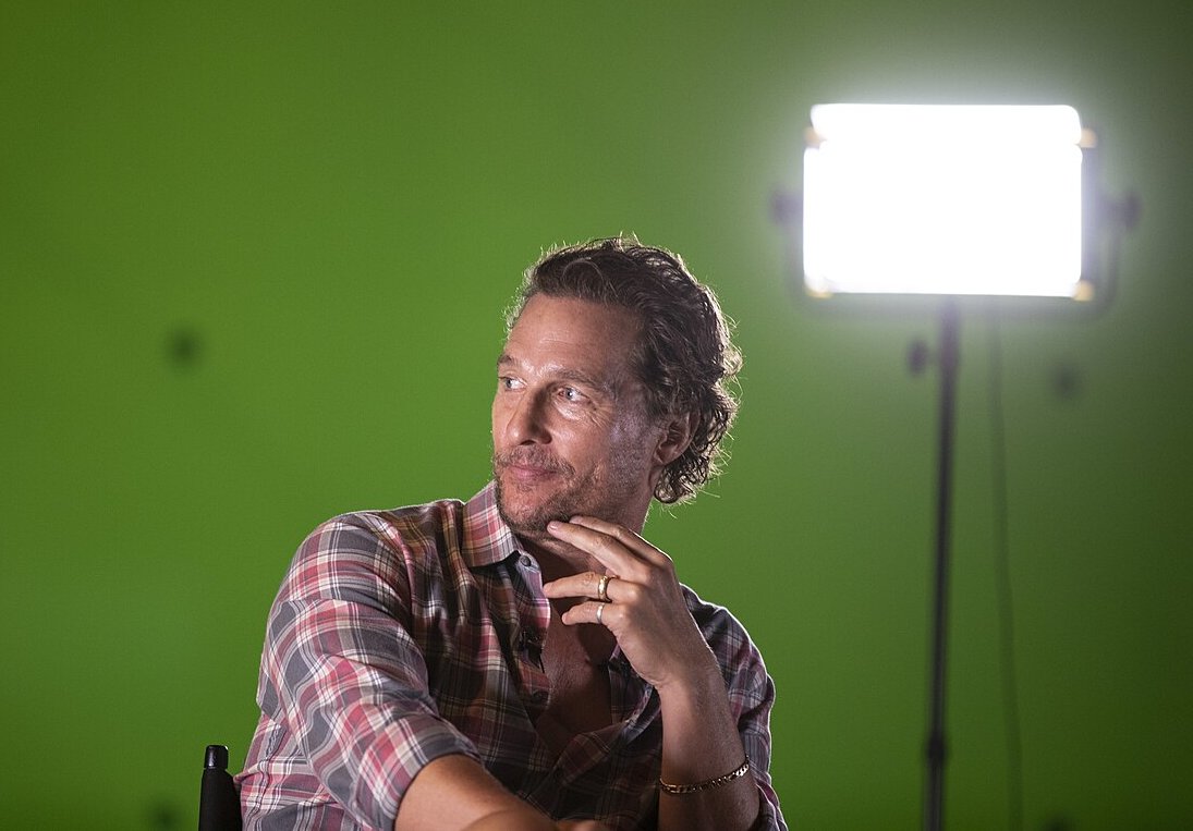 Matthew McConaughey wearing a shirt and looking away from the camera