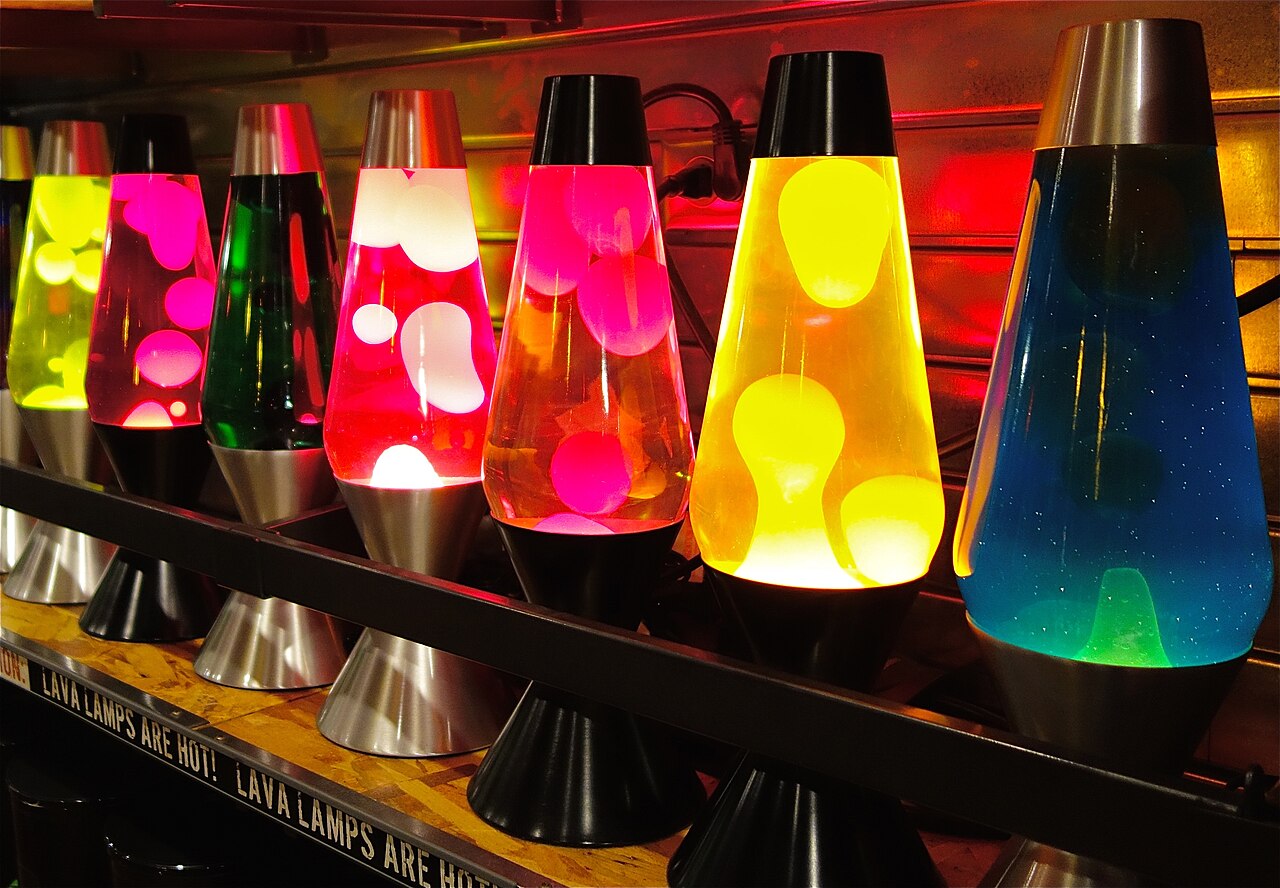 A shelf with multiple lava lamps